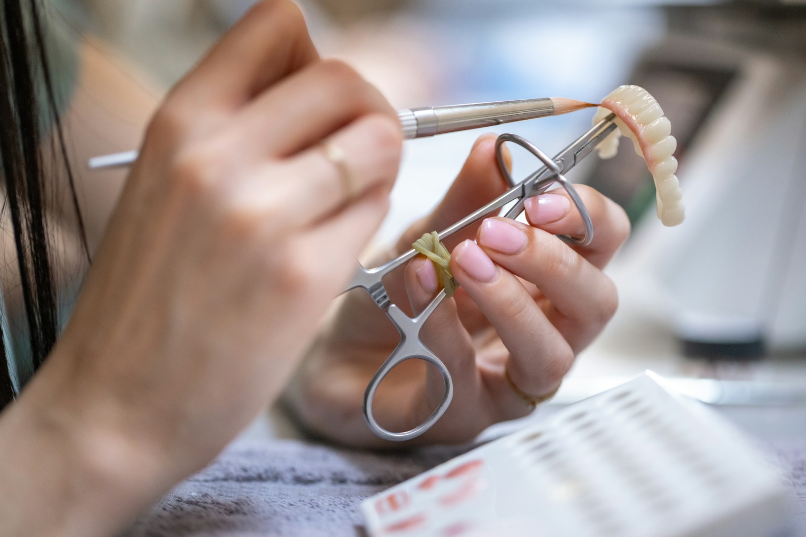 Dental specialist crafting a prosthetic restoration with precision tools